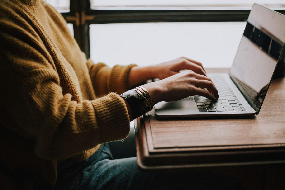 Person typing a Bison Cash tribal loan application online — the process takes under 5 minutes